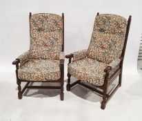 Possibly Ercol three-piece suite comprising two-seater sofa and two armchairs, in foliate upholstery