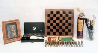 Brass chess pieces, a miniature travelling chess set, quantity of painting items and a photo album
