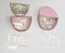 Quantity of 19th century mother-of-pearl engraved gaming counters in two demi-lune paper boxes