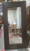 Large modern full length wall mirror of rectangular form within thick black stained wooden frame,