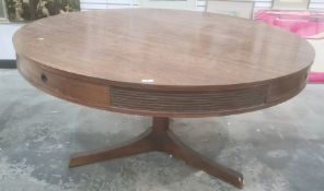 Archie Shine for Heal's circular centre table in rio rosewood, four drawers to frieze on cylindrical