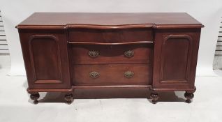 19th century breakfront mahogany sideboard with three drawers flanked by cupboard door, on turned