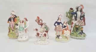 Six Staffordshire pottery figures, mid 19th century, comprising a highlander spill vase, 32cm