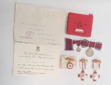 Three British Red Cross medals, boxed and a lady's 1935 Silver Jubilee medal and miniature, boxed