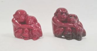 Two Royal Doulton flambe groups of monkeys, printed marks, circa 1920, one with black EM monogram to