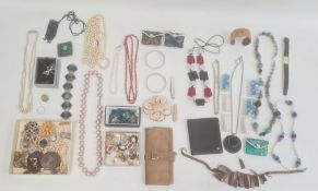 Large quantity of costume jewellery including an enamelled tin flower brooch, a large plastic flower