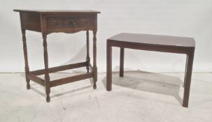 20th century trapezoidal single drawer side table on turned supports, stretchered base and a