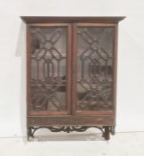 19th century mahogany two-door wall-hanging cabinet, the ogee moulded cornice above astragal-