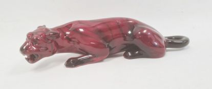 Royal Doulton flambe model of a crouching tiger, circa 1920, printed black marks, 24cm long
