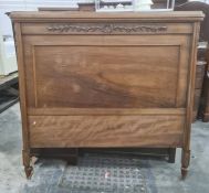 Walnut frame bed, the head and footboard of panel design with carved decoration, with wooden sides