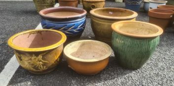 Five glazed circular garden planters in various colours, largest 48cm diameter (5)