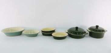 Collection of green and cream Le Creuset ceramic (stoneware) cookware including two lidded