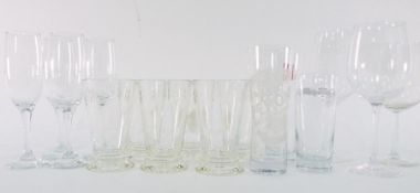 Assorted glassware to include tumblers, two Peroni glasses and others, white ramekins, cut glass