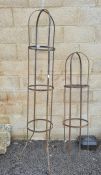 Two wrought iron round obelisk plant supports with fleur-de-lys finial, each 36cm diameter, 213cm