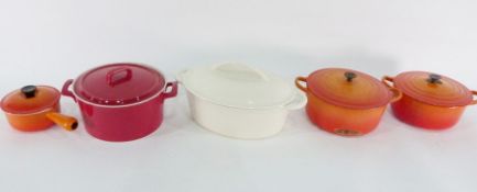 Large Maxwell Williams ceramic casserole, a cream cast iron casserole, two orange Le Creuset