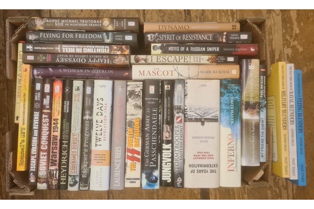 Militairia, four boxes of books and DVDs on the subject of war, including WWII, to include - Image 1 of 8