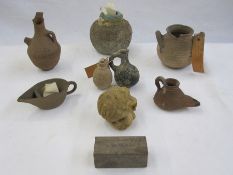 A quantity of ancient pottery vessels, first Millennium BC, some with tickets attached  These