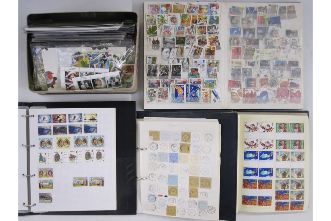 Three albums and a tin of GB, mostly of Queen Elizabeth II used stamps, one album of Jersey mint new