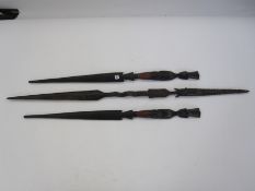 Pair of African carved ceremonial figure heads spears and another larger (3)