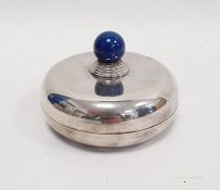 A 20th century silver coloured metal circular lidded trinket dish, with lapis lazuli style