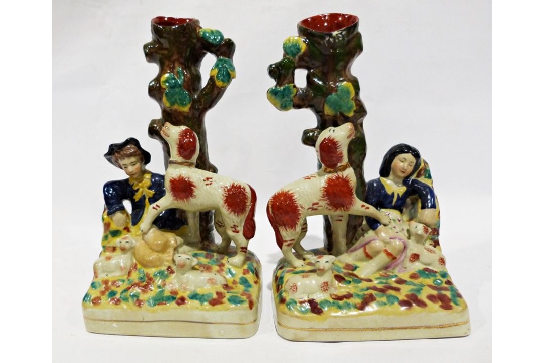 Pair of reproduction Staffordshire vases, the bases of each modelled with a seated figure surrounded - Image 1 of 2