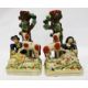 Pair of reproduction Staffordshire vases, the bases of each modelled with a seated figure surrounded - Image 1 of 2