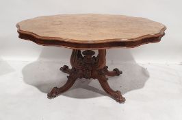 19th century walnut table, the shaped top with moulded edge, on single pedestal support consisting