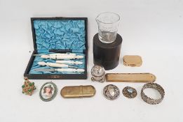 Costume jewellery gilt metal serpent necklace, mother-of-pearl lead necklace, Trifari brooch and a