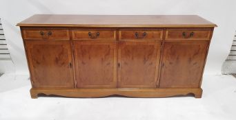 Modern yew sideboard with four drawers, four cupboard doors, on bracket feet, 181cm x 81cm