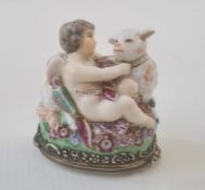 19th century French porcelain figural bonbonniere in Chelsea style modelled with cupid and a