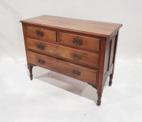 20th century walnut chest of two short over two long drawers, on turned supports to castors, 107cm x
