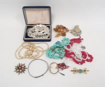 Shell cameo brooch in silver-coloured mount, a diamante bird brooch, a red paste necklace and