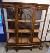 20th century mahogany breakfront display cabinet with ogee moulded cornice above central astragal-