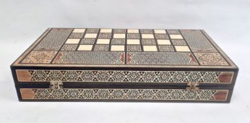Parquetry inlaid chequerboard games box, hinged with various playing pieces, 51cm wide