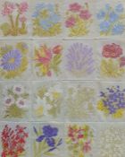 Sixteen silk floral embroidered panels stitched together and glazed, 24 x 19cm