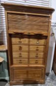 Early 20th century tambour-fronted filing cabinet, the moulded cornice above the tambour front,