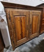 19th century French armoire, the moulded cornice above two panelled doors enclosing shelves, on