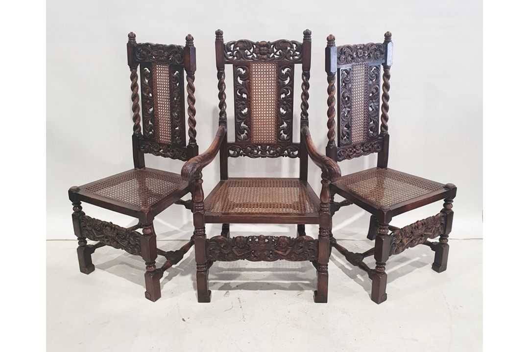 Set of eight Jacobean-style cane-backed and seated chairs including two carvers, carved backs and
