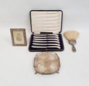 Small silver card tray by Hawksworth, Eyre & Co, Sheffield 1930, of shaped square form on four