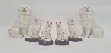 Pair Staffordshire pottery spaniels with gilt highlights, 16cm high, pair smaller Staffordshire