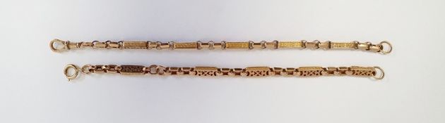 Two sections of gold-coloured watch chain, with alternate faceted links and rectangular pierced