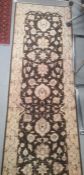 Modern Eastern-style brown ground rug with cream foliate decoration, 306cm x 84cm