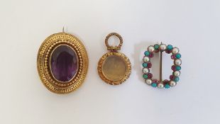 Victorian gold-coloured brooch, set with a mixed cut oval amethyst within a bead and greek key