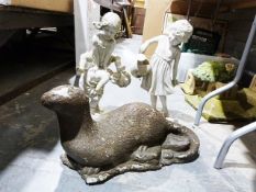 Two modern resin garden statues of children and a concrete model of an otter (3)