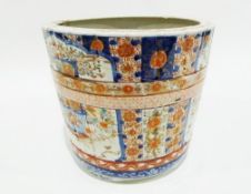 Large Japanese jardinere of barrel design painted in the Imari palette with panels of baskets of