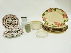 Two papier-mache model cars, a Harman/Kardon speaker system, various ceramics, household items