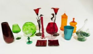 Quantity of coloured glass including a large orange glass goblet, a green glass swan vase, a metal