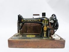 Singer sewing machine decorated with Egyptian style motifs, No. S7127435 in wooden case