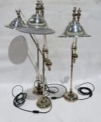 Three modern stainless steel cantilever table lamps (3)