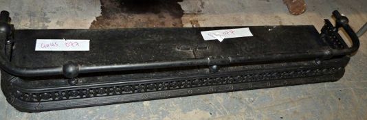 Cast iron fire curb painted black, 122cm long